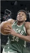  ?? ?? Giannis Antetokoun­mpo scored 12 points, eight rebounds and nine assists for the Bucks