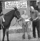  ??  ?? Alexa Higgins of Greentop, Mo., and her mule, Sally, tied to win the youth Negel Hall Memorial Award which was presented to her by Don Shockley.