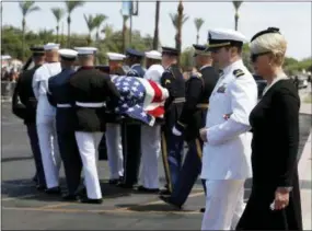  ?? JAE C. HONG — THE ASSOCIATED PRESS ?? Cindy McCain walks with her son Jack as the honor guard carries the casket after a memorial service for Sen. John McCain, R-Ariz. at the North Phoenix Baptist Church on Thursday, Aug. 30, 2018, in Phoenix.