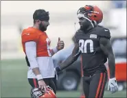  ?? RON SCHWANE — THE ASSOCIATED PRESS TONY DEJAK — THE ASSOCIATED PRESS ?? Browns center Nick Harris (53) works against defensive tackle Larry Ogunjobi (65) as Baker Mayfield looks to throw during an Aug. 14 practice in Berea.
Baker Mayfield talks with Jarvis Landry during practice Aug. 27 in Berea.