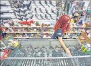  ?? AP/FILE ?? Diane Rowe, owner of Papas Pawn & Gun, disinfects the counter after a costumer visit in Grants, New Mexico, US.