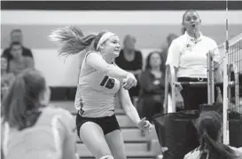  ?? MATT HAZLETT/BALTIMORE SUN MEDIA GROUP ?? Elayna Williams of No. 2 Mount Hebron plays a shot against No. 13 Reservoir on Monday. Williams finished with 19 kills and six aces as the Vikings won their 14th straight.