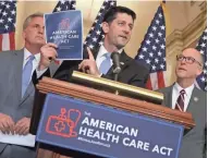  ?? GETTY IMAGES ?? House Speaker Paul Ryan (R-Wis.) holds up a copy of the new health care act during a news conference with House Majority Leader Kevin McCarthy (R-Calif.) (left) and House Energy and Commerce Committee Chairman Greg Walden (R-Ore.).