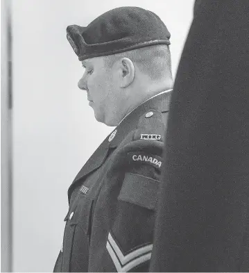  ?? ANDREW VAUGHAN / THE CANADIAN PRESS ?? Cpl. Garett Rollman arrives at a military court in Kentville, N.S., on July 31. Rollman, who was accused of using an inappropri­ate term for a black co-worker’s hair and of later striking a supervisor, has been found not guilty.