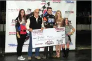  ?? RICK KEPNER - FOR DIGITAL FIRST MEDIA ?? Dylan Hoch, center, poses with the Scrapper award check from the Slingshot race at the Allentown indoor race on Jan. 5.