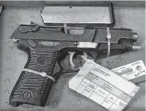  ?? STEVE BRUCE • THE CHRONICLE HERALD ?? This Ruger .45-calibre, semi-automatic pistol was recovered by police after a shooting on Dresden Row in downtown Halifax in August 2019. The gun was entered into evidence Friday at the trial for two men charged with attempted murder.