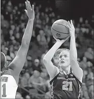  ?? AP/JAMES CRISP ?? Oregon State’s Marie Gulich (right) shoots while under pressure from Baylor’s Kalani Brown during the first half of Friday’s women’s NCAA Tournament regional semifinal in Lexington, Ky. Gulich had 26 points and nine rebounds as the Beavers advanced...