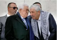  ?? (Mohamad Torokman/Reuters) ?? ABBAS CONFERS with senior Fatah official Mahmoud Aloul (right) during a ceremony marking the anniversar­y of the death of late PLO leader Yasser Arafat, in Ramallah on November 11, 2018.