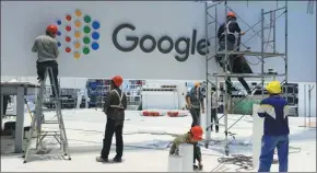  ??  ?? Google Inc’s booth is being prepared at the CIIE host venue in Shanghai on Oct 28.