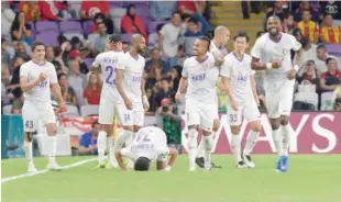  ??  ?? Al Ain players celebrate after beating Tunisia’s Esperance Tunis in the second round match of the Club World Cup on Saturday.