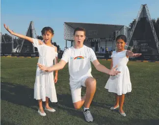  ?? Picture: JASON O'BRIEN ?? Choir member and Young Ambassador Luke Harrison with Mia Abra and Calleigh King who will perform at the Mayors Christmas Carols this afternoon.