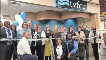  ?? / Catoosa Chamber ?? Tennessee Valley Federal Credit Union celebrated the grand opening of a branch in the new Food City on U.S. 41 in Fort Oglethorpe with a Catoosa County Chamber of Commerce ribbon-cutting. Kneeling, from left: TVFCU Financial Services Representa­tives Jonathan Campbell, Noel Michael and Trey Suttles. Standing (with scissors) is Branch Manager Cathy Jo Rector.