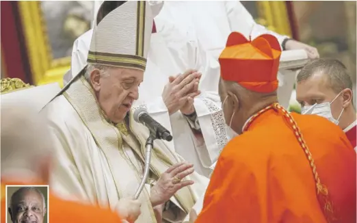  ?? FABIO FRUSTACI/ POOL VIA AP ( ABOVE); ANDREW HARNIK/ AP FILE ( LEFT) ?? New Cardinal Wilton Gregory ( above and inset, left) receives his red hat, a biretta, from Pope Francis on Saturday at the consistory ceremony at St. Peter’s Basilica at the Vatican.