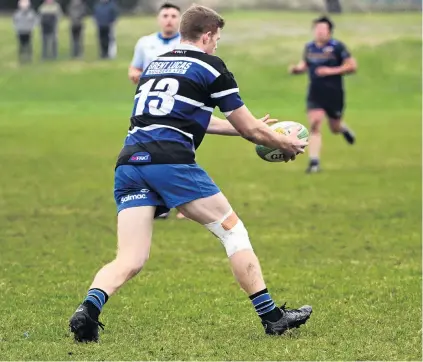  ?? PHOTO: LINDA ROBERTSON ?? Centre of attention . . . Kaikorai centre Ben Miller has possession of the ball against Dunedin at Kettle Park on Saturday.