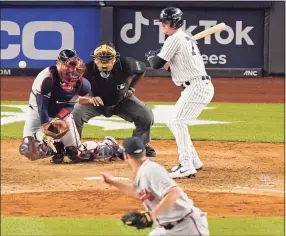  ?? Kathy Willens / Associated Press ?? New York Yankees pinch hitter Clint Frazier, right, watches as Braves catcher Travis d’Arnaud loses track of a wild pitch thrown by relief pitcher Tyler Matzek, foreground, during the eighth inning Tuesday.