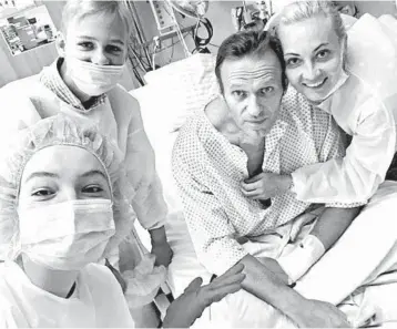  ?? INSTAGRAM ?? Russian dissident breathing on his own: In a photo posted on his Instagram account Tuesday, Russian opposition leader Alexei Navalny is seen with his wife, Yulia, right, and medical workers in a Berlin hospital. Navalny, 44, is recuperati­ng from being poisoned with a nerve agent. Russia has denied having Navalny poisoned. He fell ill on a flight Aug. 20.