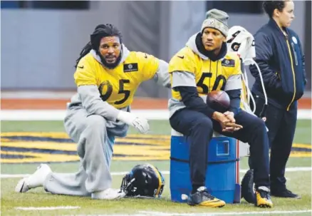  ??  ?? Pittsburgh linebacker­s Jarvis Jones, left, and Ryan Shazier take a break during practice this week. The Steelers have been dubbed “Linebacker U” by assistant coach Joey Porter, a former Colorado State star. Gene J. Puskar, The Associated Press