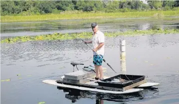  ?? KEVIN SPEAR/STAFF ?? Mike Housel, a Lake Druid resident, often explores the lake. He thinks cattails, hydrilla and muck should be removed.