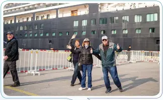  ?? Photos: VCG. ?? Passengers step down from the internatio­nal cruise ship Zuiderdam, operated by Holland America Line, and pose happily for photos when the ship docks at Tianjin Internatio­nal Cruise Home Port in North China on March 11, 2024. Over 1,100 tourists from 30 countries and regions boarded the cruise ship.