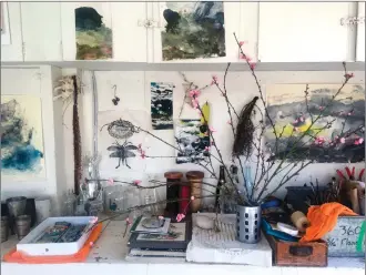  ?? Associated Press photos ?? This photo provided by artist Louesa Roebuck shows her work studio in Ojai, Calif. Some of her monotype studies are seen. A few pieces by friends and creative growth artist also adorn the studio along with the peach blossoms.