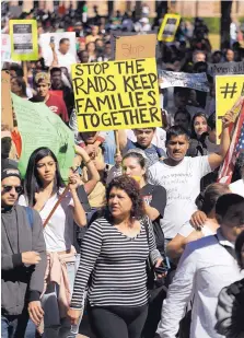  ?? ERIC GAY/ASSOCIATED PRESS ?? A group marches away from the Texas Capitol during an immigratio­n protest on Thursday in Austin, Texas. Immigrants around the U.S. stayed home from work and school for “A Day Without Immigrants.”