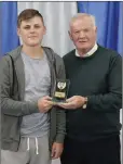  ??  ?? Sam Fowler accepts the under-15 Players Player award from club President John Byrne.