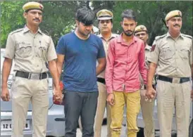  ?? SUSHIL KUMAR/HT PHOTO ?? Siddharth Mehrotra (in blue) and his aide in police custody on Monday.