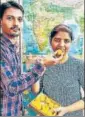  ?? HT ?? ■ Meenakshi Pandey being offered sweets by her brother.HT