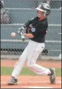  ?? NEWS PHOTO RYAN MCCRACKEN ?? Lethbridge Southwest All Stars catcher Lyle Steadman sends an RBI single into the outfield during Friday's Canadian Little League Championsh­ip game against the Glace Bay Colonels at Lovell McDonnell Field.