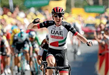  ?? AP ?? Ireland’s Daniel Martin celebrates as he crosses the finish line to win the sixth stage of the Tour de France.