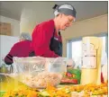  ?? PHOTO /FILE ?? Karyn Rogers preparing lunches as part of the Ka Pai Kai initiative.