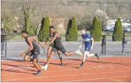  ?? Tim Godbee ?? A pair of Calhoun relay runners pass the baton during the Yellow Jackets’ three-team meet last week at the high school against Ringgold and Murray County.