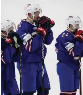  ?? APPHOTO ?? DOWN AND OUT: Team USA players react after yesterday’s 4-2 loss to Sweden in the semifinals of the world junior hockey championsh­ips in Buffalo, N.Y.