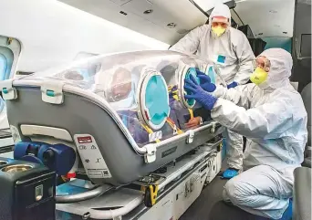  ??  ?? The EpiShuttle — portable, self-contained medical isolation units — has fully recycled air supply and high density glove attachment­s, which let access to the patients without contaminat­ion.