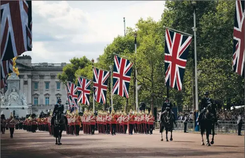  ?? (File Photo/ap/felipe Dana) ?? Guards escort the coffin of Queen Elizabeth II on Wednesday during a procession from Buckingham Palace to Westminste­r Hall in London. Stories circulatin­g online incorrectl­y claim all funeral services in the U.K. have been canceled on Monday, the day Queen Elizabeth II is set to be buried.