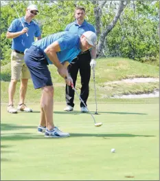  ??  ?? Jody Shelley makes a putt during the 14th annual Jody Shelley Golf Fore Health four ball scramble at the River Hills Golf Course in Clyde River on July 13, while teammates Rob Leimkuhler from Columbus Ohio, left, and former Halifax Moosehead’s player...