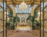  ?? THE PLAZA VIA AP ?? This undated photo provided by the Plaza in New York City shows the hotel’s Palm Court, known for its elaborate afternoon teas. On May 19, the hotel is hosting a $150 Champagne breakfast in the Palm Court with livestream­ing of the royal wedding of...