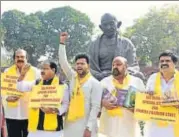  ?? ARVIND YADAV/HT ?? TDP leaders hold a protest demanding special status for Andhra Pradesh at the Parliament complex on Monday.