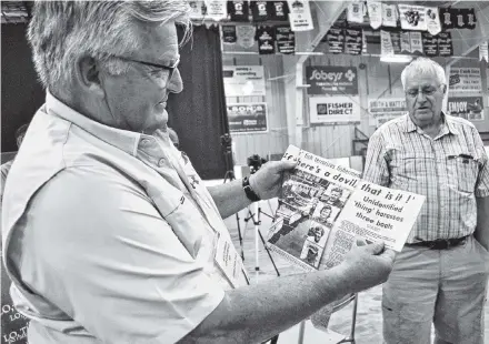  ?? Kathy Johnson ?? Cape Sable Island fisherman Rodney Ross holds up a clipping from the July 14, 1976, Yarmouth Vanguard that chronicled the story of the encounter by five fishermen aboard three fishing boats with a mysterious sea creature.