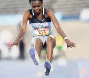  ?? GLADSTONE TAYLOR/ PHOTOGRAPH­ER ?? Class Two girls long jump winner Annia Ashley (Edwin Allen) compete at the National Stadium during the ISSA/ GraceKenne­dy Boys and Girls Athletics Championsh­ips on Wednesday. Ashley jumped 5.92m for the win.