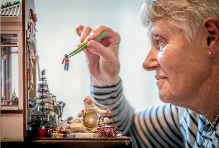  ?? PHOTOS: ROBERT KITCHIN/FAIRFAX NZ ?? Creating tiny things requires tiny tools. Kapiti Coast resident Mavis Cheyne says that tweezers are a miniaturis­t’s best friend.