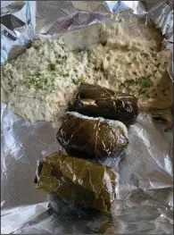  ?? (Arkansas Democrat-Gazette/Eric E. Harrison) ?? We got baba ghanoush (clockwise from top left), hummus and dolmas in our Appetizer Trio from Istanbul Mediterran­ean Restaurant in the Pleasant Ridge Town Center on Cantrell Road in west Little Rock.