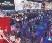  ?? JORDAN STRAUSS/THE ASSOCIATED PRESS ?? Fans flock to play Super Smash Bros. Ultimate at the Nintendo booth during the Electronic Entertainm­ent Expo.