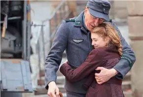  ??  ?? Liesel (Sophie Nélisse) can’t help being overjoyed that her foster father Hans (Geoffrey rush) has returned home from the war.