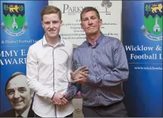  ??  ?? John Shea presents Dean Flood Hayes of Arklow United with the Division 3 Player of the Year award.