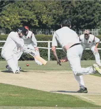  ??  ?? Dawdon’s Mark Ewart bowls at Littletown’s Jordan Woodley.