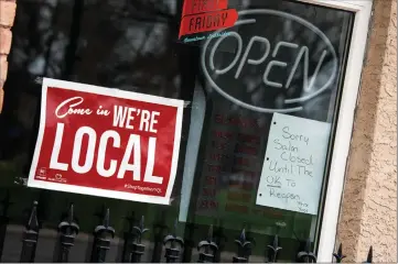  ?? Herald photo by Ian Martens ?? A sign posted at a downtown salon storefront marks their closure, as the Lethbridge Economic Recovery Task Force continues to ask council to help local businesses weather the COVID-19 economic storm. @IMartensHe­rald