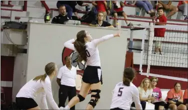  ?? Terrance Armstard/News-Times ?? Drop the hammer: West Side Christian's Anna Williams goes up for a spike against Garrett Memorial. The Lady Warriors travel to Little Rock today to take on Southwest Christian, beginning at 5 p.m.