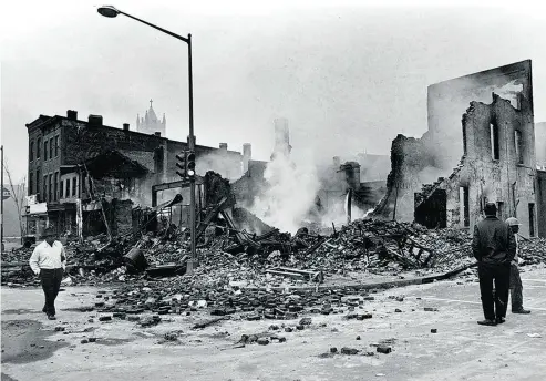  ?? THE ASSOCIATED PRESS FILES ?? Smoulderin­g ruins remain where a building stood at 7th and O streets in northwest Washington on April 6, 1968.