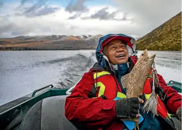  ??  ?? Winnemem Wintu tribal leader Caleen Sisk heads across Lake Heron to the sampling site for chinook salmon at Mellish Stream.